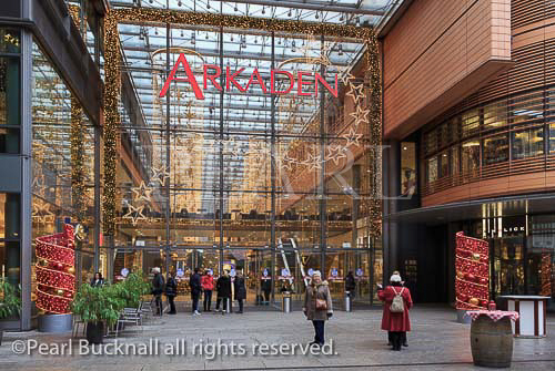Entrance to the Arkaden shopping centre decorated for 
christmas in Potsdamer Platz, Berlin, Germany, Europe.  