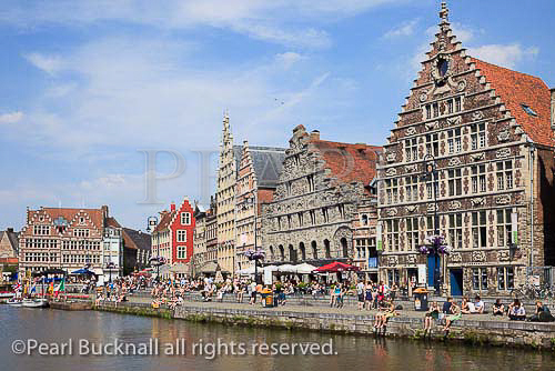 River Leie lined with medieval quayside gabbled Guild 
houses in the historical centre. Graslei Site, Ghent, 
East Flanders, Belgium, Europe.