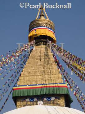 GOLDEN PYRAMID of BOUDHANATH STUPA with prayer 
flags and the all-seeing eyes of Buddha.  Important 
Tibetan stupa and largest in Nepal.  Kathmandu Nepal 
Asia
