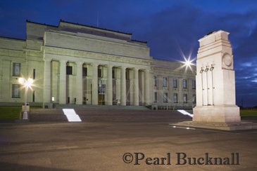 National Museum World War I memorial building and 
cenotaph Court of Honour floodlit at night in Domain 
park Auckland North Island New Zealand 

