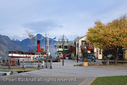 SS Earnslaw steamboat moored on Lake Wakatipu by 
the waterfront boardwalk in Queenstown, Otago, 
South Island, New Zealand.