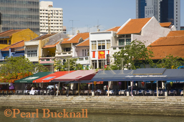 Boat Quay Conservation Area colourful historic old 
shophouse buildings on south of River now tourist bars 
and restaurants Singapore

