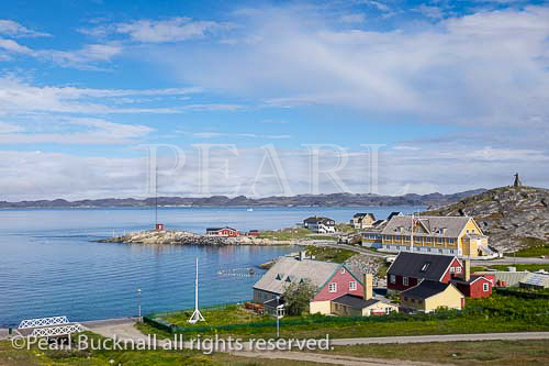 The old town and Colonial Harbour (Kolonihavnen) 
with Hans Egede House built 1728 oldest in the 
country and now venue for official government 
receptions. Hans Egede statue on hilltop beyond. 
Nuuk (Godthab), Sermersooq, Greenland
