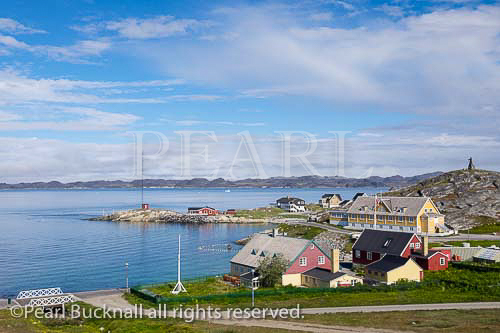 The old town and Colonial Harbour (Kolonihavnen) 
with Hans Egede House built 1728 oldest in the 
country and now venue for official government 
receptions. Hans Egede statue on hilltop beyond. 
Nuuk (Godthab), Sermersooq, Greenland