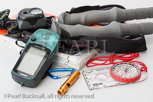 Walking equipment with Ordnance Survey Explorer 
1:25,000 map, headtorch, Silva orienteering compass, 
Garmin Etrex Venture GPS, whistle and poles. UK, 
Britain