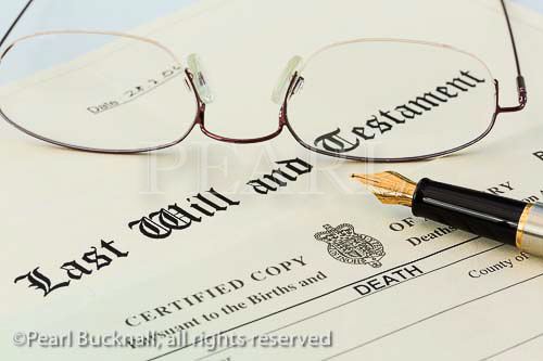 Last Will and Testament document with a Death 
Certificate, a pair of metal rimmed reading glasses and 
a fountain pen