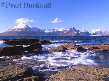 SNOW-CAPPED CUILLIN HILLS from across Loch 
Scavaig in winter.  Elgol, Isle of Skye, Highland 
Scotland, UK

Keywords: coast cold frozen icy landscape mountains 
picturesque remote scenic Scottish sea snow covered 
view water