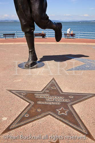 Eric Morecambe statue and star plaque with inscription 
on seafront in Morecambe, Lancashire, England, UK, 
Britain, Europe. 