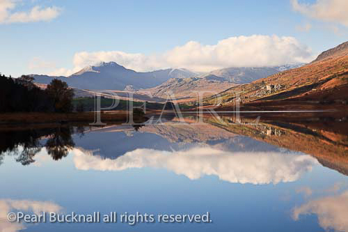 Reflections in Llynnau Mymbyr lake with view to Mount 
Snowdon Horseshoe in Snowdonia National Park in 
autumn. Capel Curig, Conwy, North Wales, UK, Europe.

Keywords:  britain british welsh mountains mountain 
landscape reflections water scenic view scene cymru 