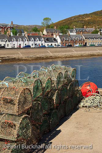 Lobster pots on the quayside in fishing harbour on 
Loch Broom on north west highlands coast. Ullapool, 
Ross and Cromarty, Highland, Scotland, UK, Britain, 
Europe. 