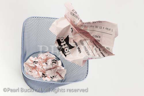 Screwed up UK Lotto lottery ticket being thrown into a
metal waste paper bin
Keywords: digital compilation luck concept
wastebasket throwing away