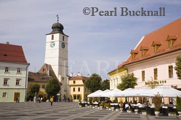 Old buildings and street cafe in Piata Mare in historic 
city of Hermannstadt. Sibiu Transylvania Romania 
Europe
