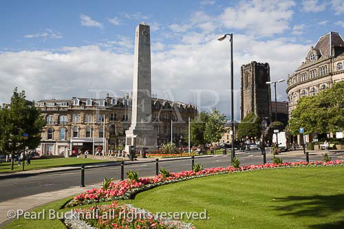 Cenotaph War memorial obelisk from across Prospect 
Gardens in town centre in summer. Harrogate North 
Yorkshire England UK Britain UK
