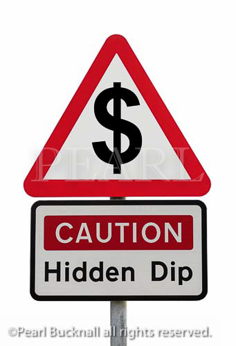 Triangular road sign warning Caution Hidden Dip 
with dollar sign to illustrate financial future concept. 
USA