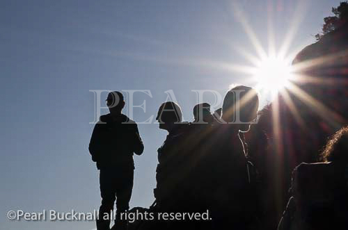Walkers in silhouette against the sun on Tryfan 
mountain in Snowdonia, North Wales, UK, Britain, 
Europe. 