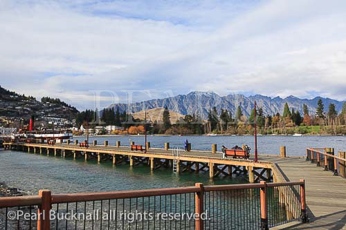Waterfront boardwalk on bay in Lake Wakatipu, 
Queenstown, Otago, South Island, New Zealand.