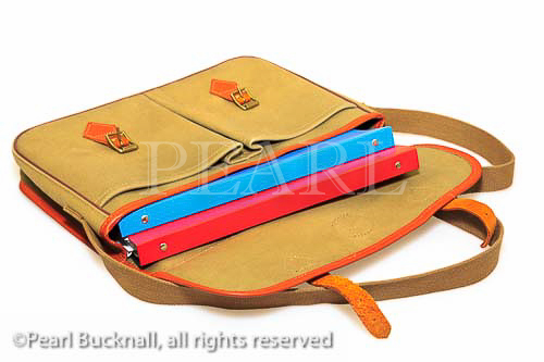 Traditional khaki canvas and leather briefcase 
containing folders isolated on a white background.
