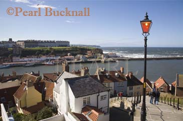 Old Town buildings rooftops lamp post and River Esk 
harbour looking down from steps on East Cliff. Whitby 
North Yorkshire England UK Europe

Keywords: heritage coast north town Britain British
