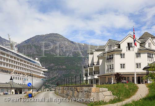 Cruise ship moored in port by the Quality Hotel and 
Resort in Eidfjorden fjord at Eidfjord, Hardanger, 
Hordaland, Norway, Scandinavia, Europe