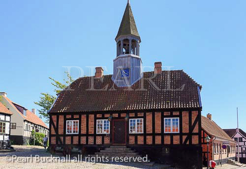 Former Town Hall 1789 with church bell tower in 
cobbled town square is now a museum in Ebeltoft, 
Jutland, Denmark, Scandinavia, Europe
