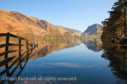 Scenic view across Buttermere Lake with mountains 
reflected in still water in the Lake District National 
Park. Buttermere, Cumbria, England, UK. 

english scenic landscape britain british