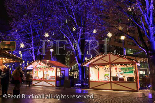 Traditional Christmas market stalls at night in 
Potsdamer Platz, Berlin, Germany, Europe.  