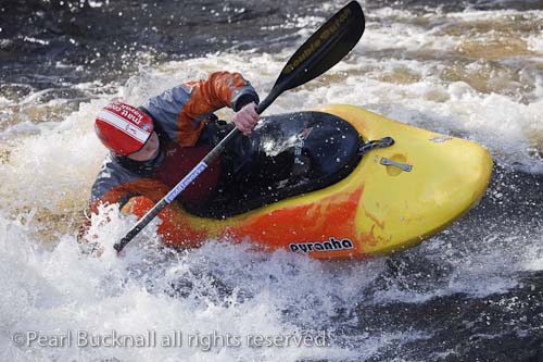 Kayaking in whitewater on the Tryweryn River at the 
National Whitewater Centre, Frongoch, Gwynedd, 
North Wales, UK, Europe. 

Keyword: kayak white water canoe canoeing 