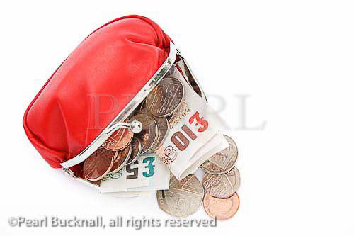 Red money purse containing ten and five pound notes 
with some coins spilling out

Studio still life sterling financial concept UK Britain 
British nobody