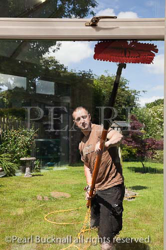 Window cleaner using a soapless pure water fed pole 
and brush window cleaning system for spotless glass 
windows. From inside looking out.