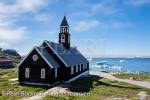 18th century wooden Zions Kirke or Zion Church 
overlooking Disco Bay with icebergs floating. 
Ilulissat (Jakobshavn), Qaasuitsup, Greenland
