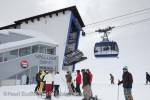 St Anton am Arleberg, Tyrol, Austria, Europe.  Skiers 
and Valluga Bahn with cable car at Galzig gondola 
summit station in Austrian Alps

Keywords: alpine skiing winter sports activity snow 
mountains people
