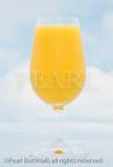 Glass of fresh orange juice against blue sky 
background. Studio still life. 