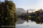 View along River Loue with morning mist in autumn in 
Loue valley. Ornans, Doubs, Franche Comte, France, 
Europe
