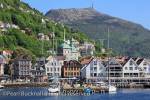 View across Vågen harbour to Mount Ulriken above 
historic Fiskerestaurant on Torget in city of Bergen, 
Hordaland, Norway, Scandinavia, Europe