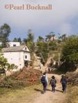 CHILDREN WALKING to SCHOOL on dirt road from 
Kavre village to Dhulikhel near the Kali Temple on the 
hill in the Himalayan foothills of rural Nepal Dhulikhel, 
Kathmandu Valley, Nepal, Asia
