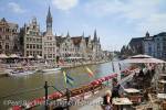 Riverside cafe and view across the River Leie to 
medieval guild houses on Graslei quay and St Michaels 
bridge in the historical centre. Korenlei Site, Ghent, 
East Flanders, Belgium, Europe. 