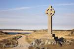 Llanddwyn Island, Newborough, Anglesey, North 
Wales, UK, Europe.  Celtic stone cross and footpath on 
Isle of Anglesey coast

Keywords: welsh walk path heritage AONB nature 
reserve landscape landmark