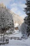 Rauris, Austria, Europe. View along mountain road to 
Gaisbachtal in alpine valley lined with fir trees 
following heavy snowfall in winter

Keywords: alps, country, snow, scene,