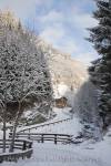 Rauris, Austria, Europe. View along mountain road to 
Gaisbachtal in alpine valley lined with fir trees 
following heavy snowfall in winter

Keywords: alps, country, snow, scene,