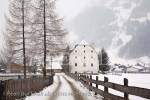 Rauris, Austria, Europe. Winter snow scene and lane to 
16th century historic building Furstenmuhle former 
bakery and mill 1565 in Alpine village

Keywords: Austrian, alps,