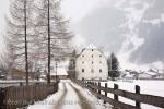 Rauris, Austria, Europe. Winter snow scene and lane to 
16th century historic building Furstenmuhle former 
bakery and mill 1565 in Alpine village

Keywords: Austrian, alps,