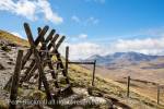 Two stiles on path from Moel Siabod to Capel Curig 
with view to Mount Snowdon Horseshoe in mountains 
of Snowdonia National Park. Capel Curig, Conwy, 
North Wales, UK, Britain.