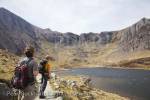 Cwm Idwal, North Wales, UK. Walkers by Llyn Idwal 
lake in the mountains of Snowdonia National Park.  

Keywords: hiking hike mountain walk men hikers 