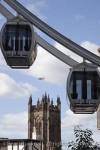 Cathedral tower beyond The Wheel of Manchester 
capsules in the city centre. Exchange Square, 
Manchester, England, UK

Keywords: architecture building city Britain British 
cities