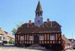 Former Town Hall 1789 with church bell tower in 
cobbled town square is now a museum in Ebeltoft, 
Jutland, Denmark, Scandinavia, Europe