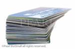 Stack of bank cards isolated on a white background. 
England, UK, Britain, Europe