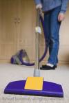 Woman sweeping room carpet with dual cyclone 
cylinder vacuum cleaner. UK Europe

Keywords: housework house work