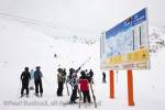 St Anton am Arleberg, Tyrol, Austria, Europe.  Skiers 
studying ski Arleberg piste map and lift information 
board by Galzig Bahn gondola summit station in 
Austrian Alps

Keywords: alpine skiing winter sports activity snow 
mountains people