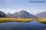 Tryfan mountain east face across Nant yr Ogof with 
pool of water reflecting blue sky in Snowdonia 
National Park. Ogwen, Conwy, North Wales, UK, Britain

Keywords: welsh landscape national park rural 
scenic water