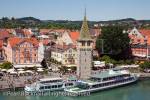Aerial view across the harbour to Mangturm tower and 
picturesque waterfront buildings on Lake Constance 
(Bodensee) Lindau, Bavaria, Germany, Europe. 